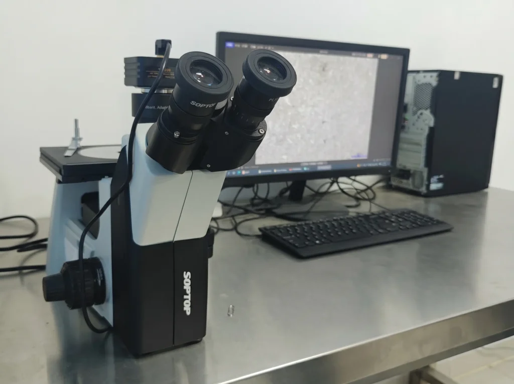 Metallurgical microscope used for quality inspection of crusher wear parts.